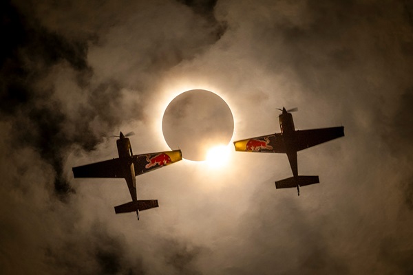 Red Bull Aerobatic Pilots Fly Through Rare Solar Eclipse, Creating Once-in-a-Lifetime Photos